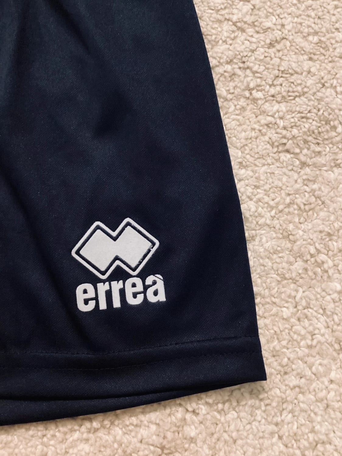 Short Errea 6A en très bon état garçon marine