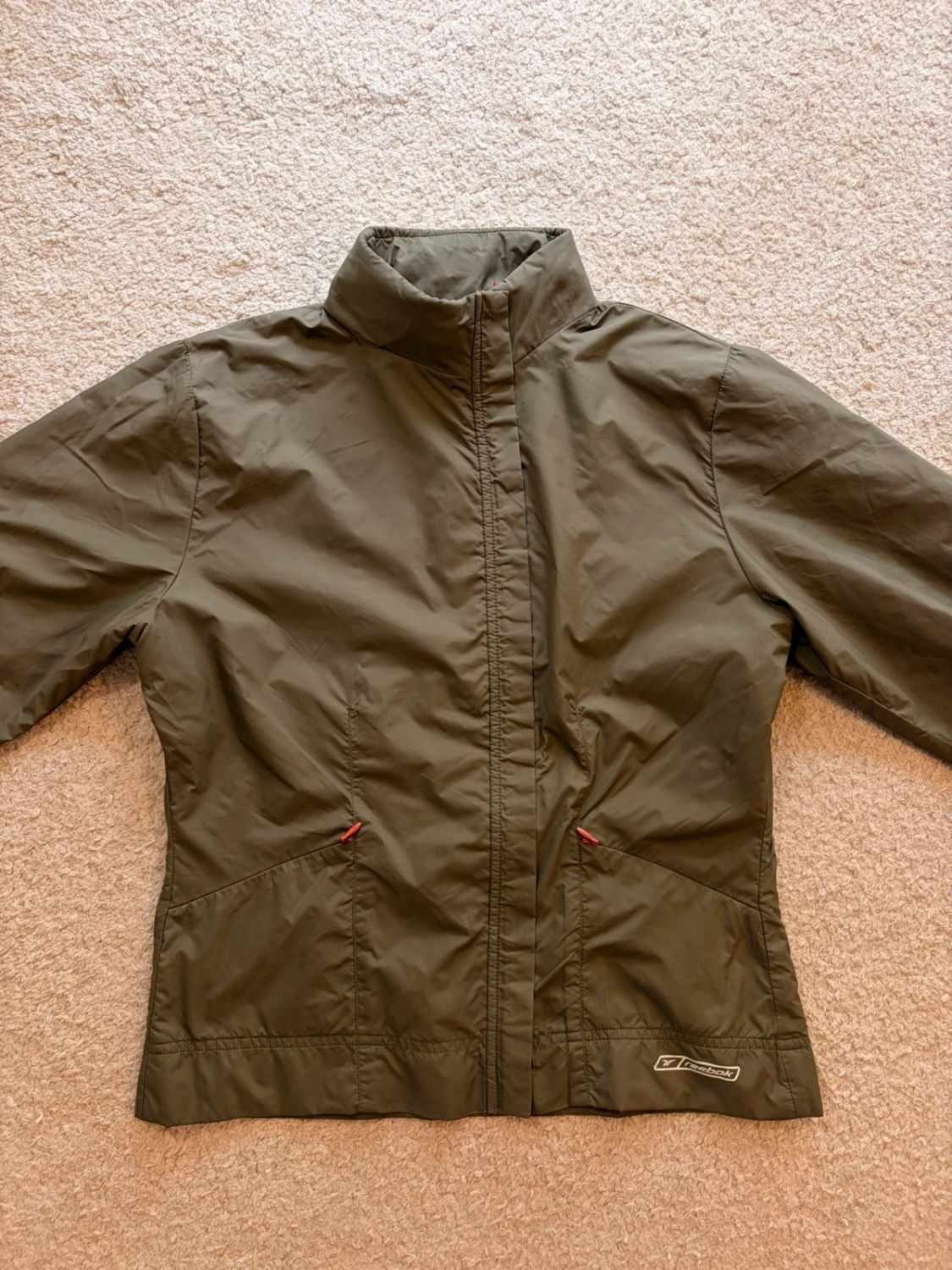 🤎 Veste Reebok Imperméable à Capuche Kaki - Protection & Style