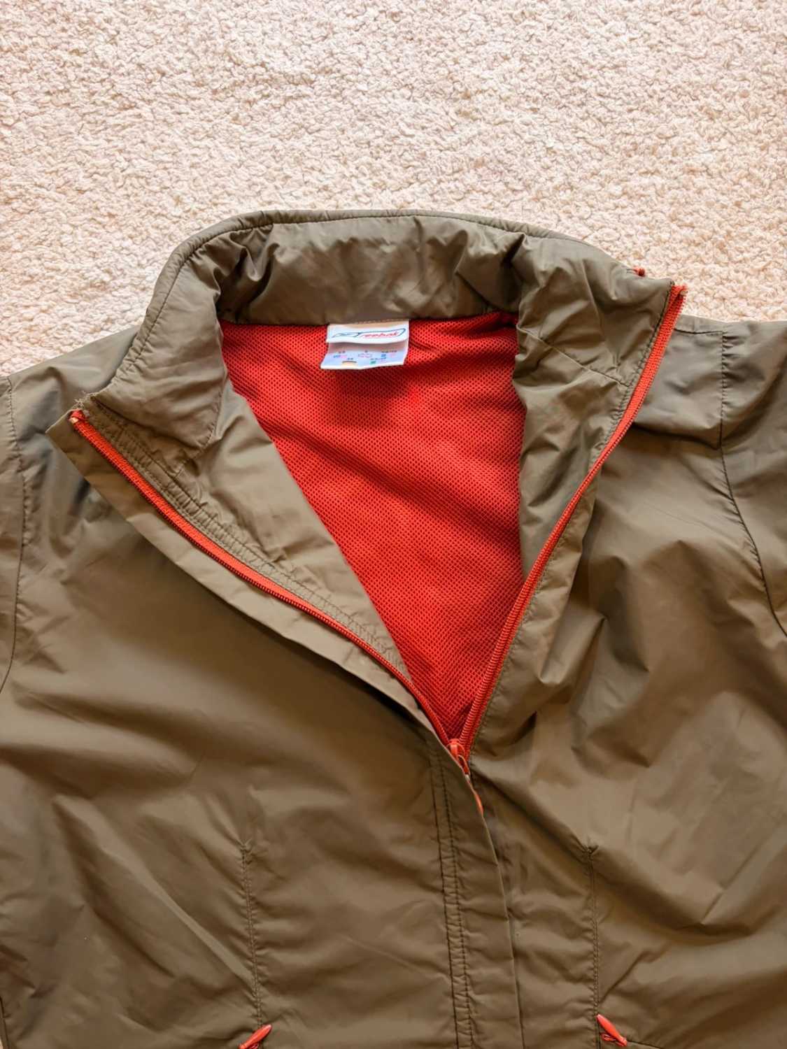 🤎 Veste Reebok Imperméable à Capuche Kaki - Protection & Style