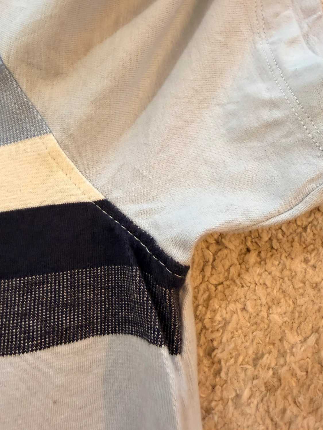 🔵 Polo DKNY à Rayures Bleu Clair/Noir - Urbain & Sophistiqué